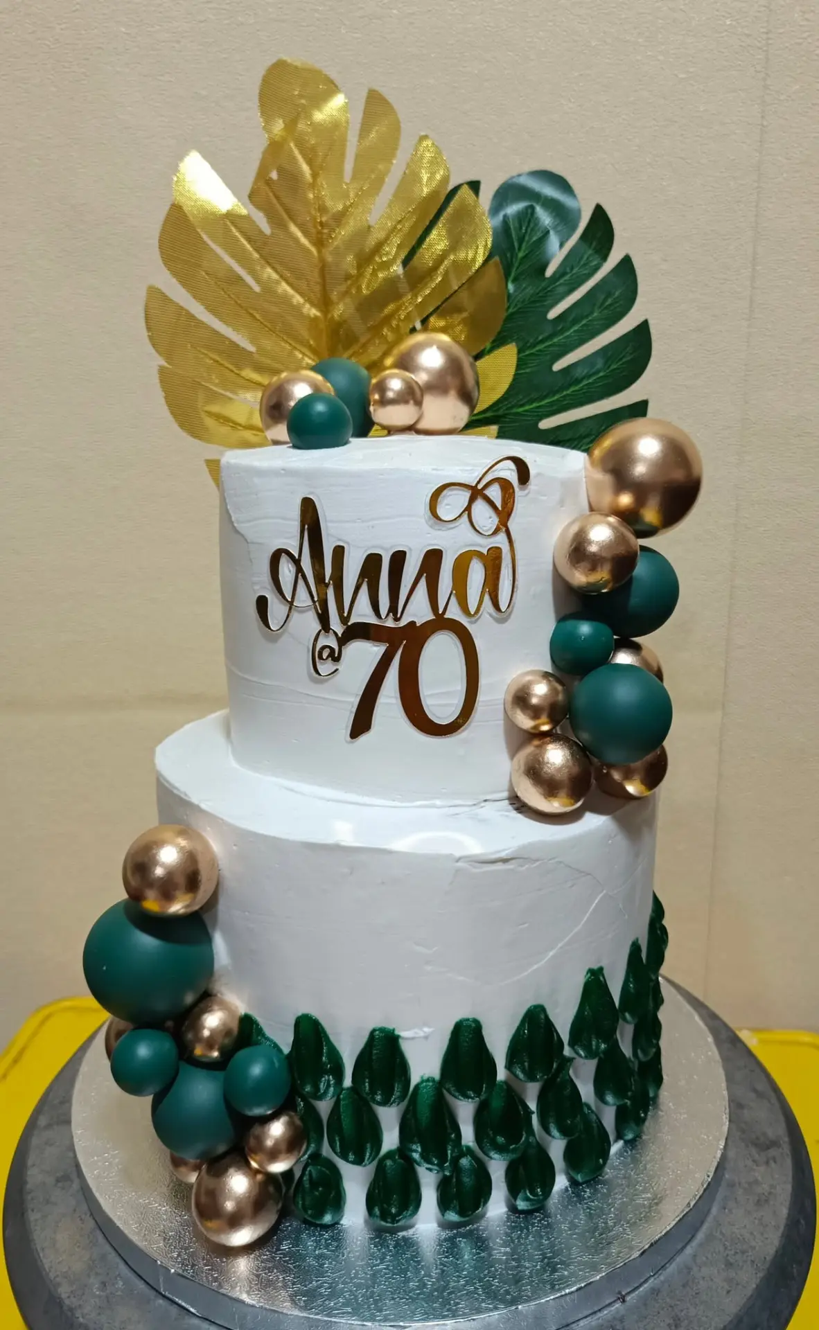 Two-tier white and gold Ladylocks milestone cake